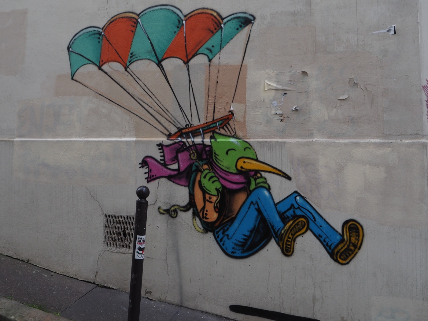 Street art bird man parachute Paris