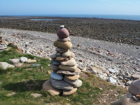 lindisfarne pebble tower low tide
